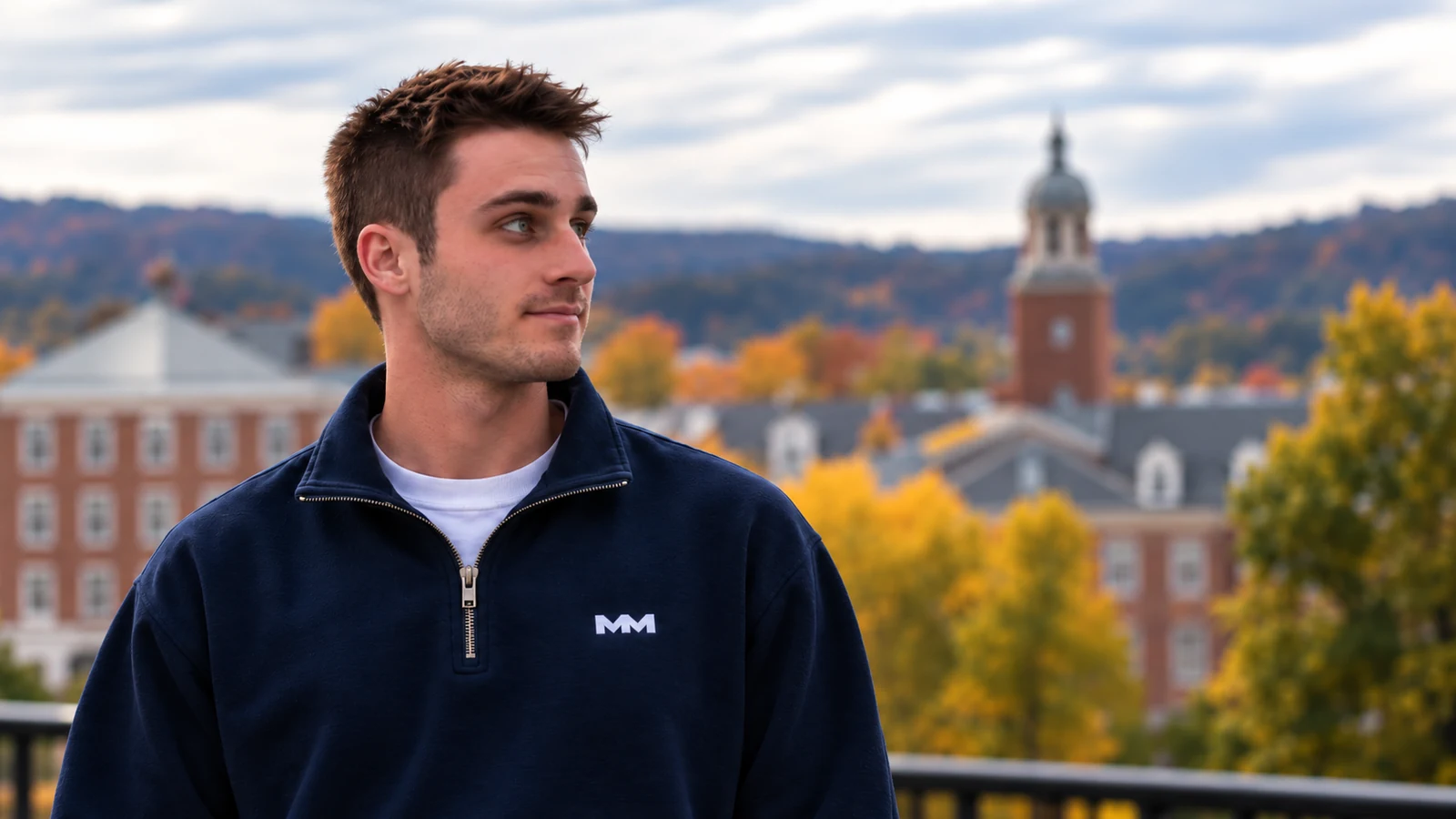 Brendan Connell in a navy Member Made quarter-zip overlooking campus