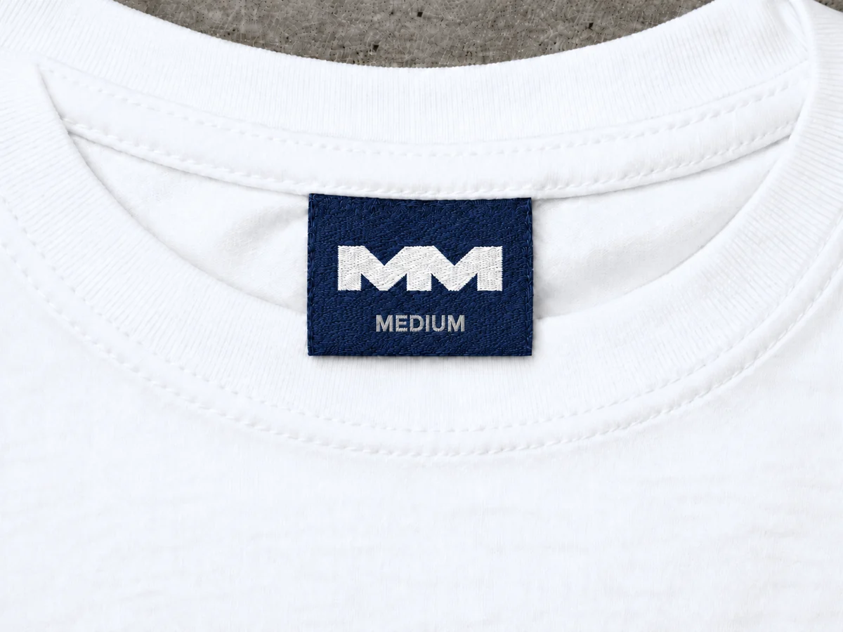 Custom woven neck label inside a white tee
