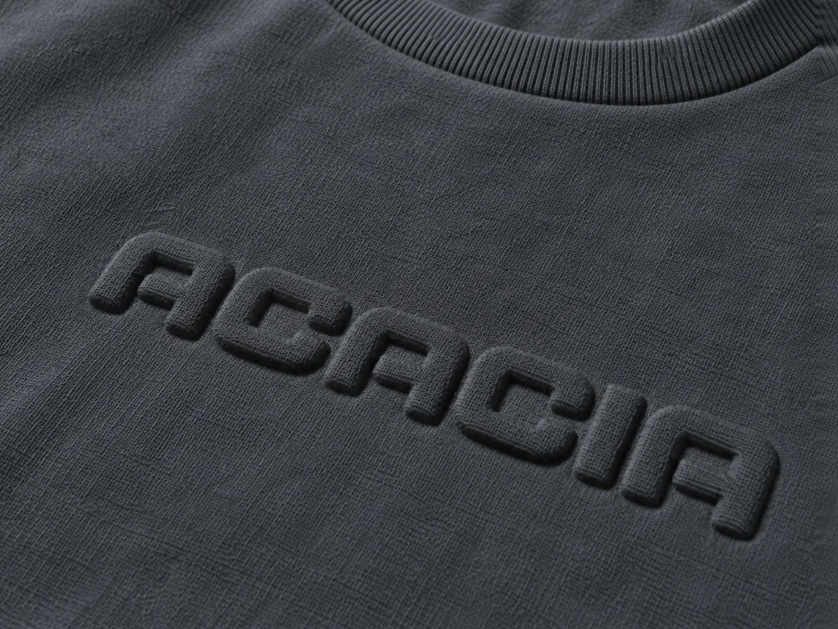 Embossed lettering on a charcoal sweatshirt