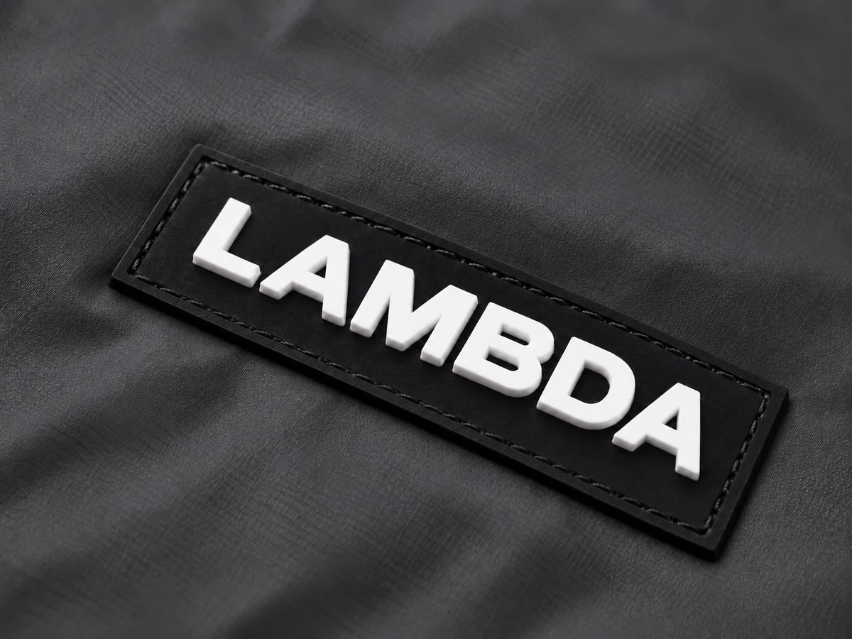 Molded PVC patch with raised lettering